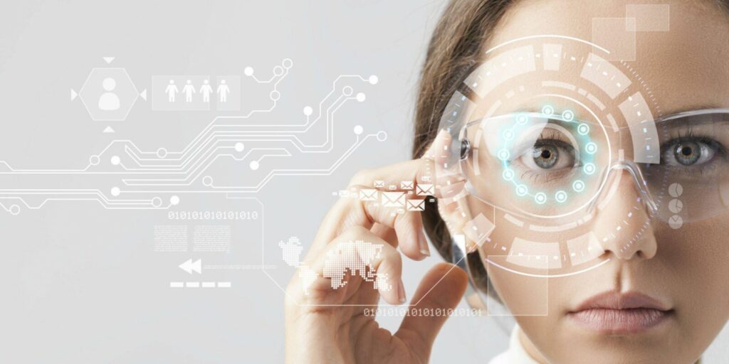 A woman wearing smart glasses with digital interface graphics overlaying her face, suggesting augmented reality technology.