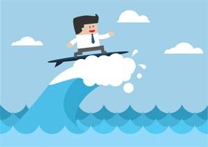 Cartoon illustration of a man in business attire surfing on a cloud above ocean waves under a blue sky with a few clouds.