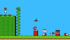 A character stands on a red platform in a pixelated video game scene with enemies, a tall vine, and a blue sky background.