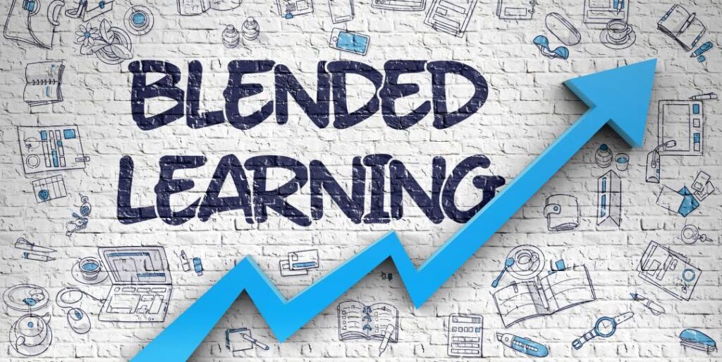 Blended Learning" written on a brick wall with digital and classroom-themed doodles in the background, and a blue upward arrow in the foreground.