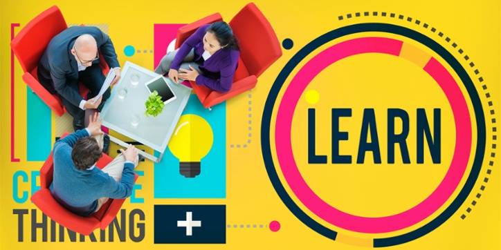 Three people sit around a table with papers and a tablet, seen from above, beside a large graphic with the word "LEARN" and the phrase "CREATIVE THINKING" on a yellow background.